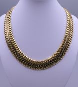 An 18 ct gold necklace. 43.5 cm long. 100.6 grammes.