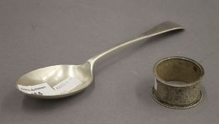 A silver spoon and a silver napkin ring. 3.2 troy ounces.