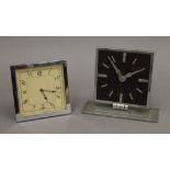 Two Art Deco style clocks. The largest 14 cm high.