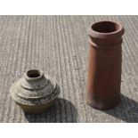 An early ceramic urn and a chimney pot.