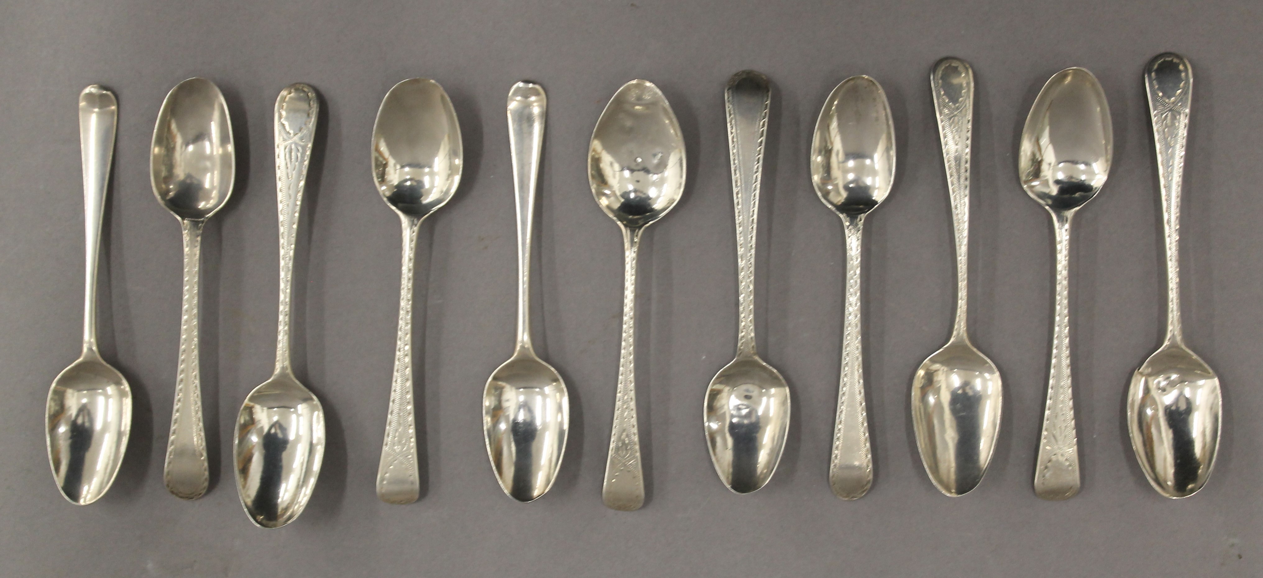 A quantity of silver teaspoons, including two Hester Bateman Hanoverian shell back teaspoons. 4.