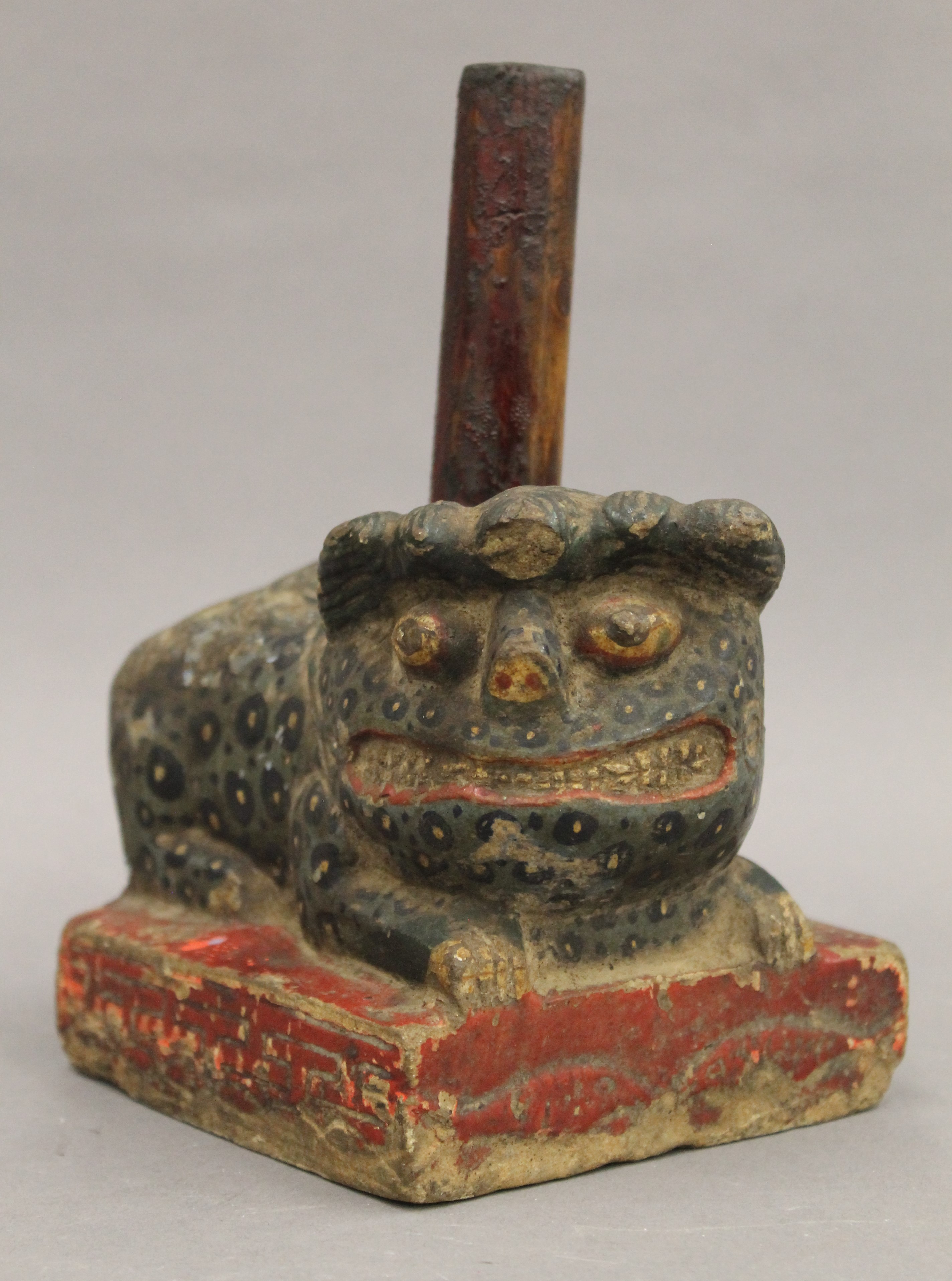 A 19th century Chinese painted carved stone dog-of-fo form incense holder. 15 cm long. - Image 3 of 5