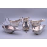Two pairs of silver sauce boats and a cream jug. The largest sauce boat 15.5 cm wide. 13.