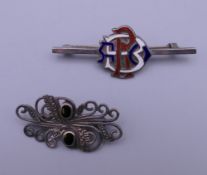 Two silver brooches. The largest 5.5 cm wide.