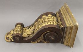 A Victorian gilded wooden corbel. 66 cm high.