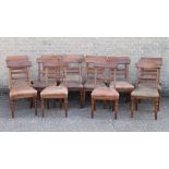 A set of 16 Victorian oak dining chairs. Each 48 cm wide.