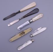 A quantity of silver, mother-of-pearl pen knives, etc.