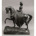 A Victorian bronze equestrian figure of the young Queen Victoria modelled riding side saddle,