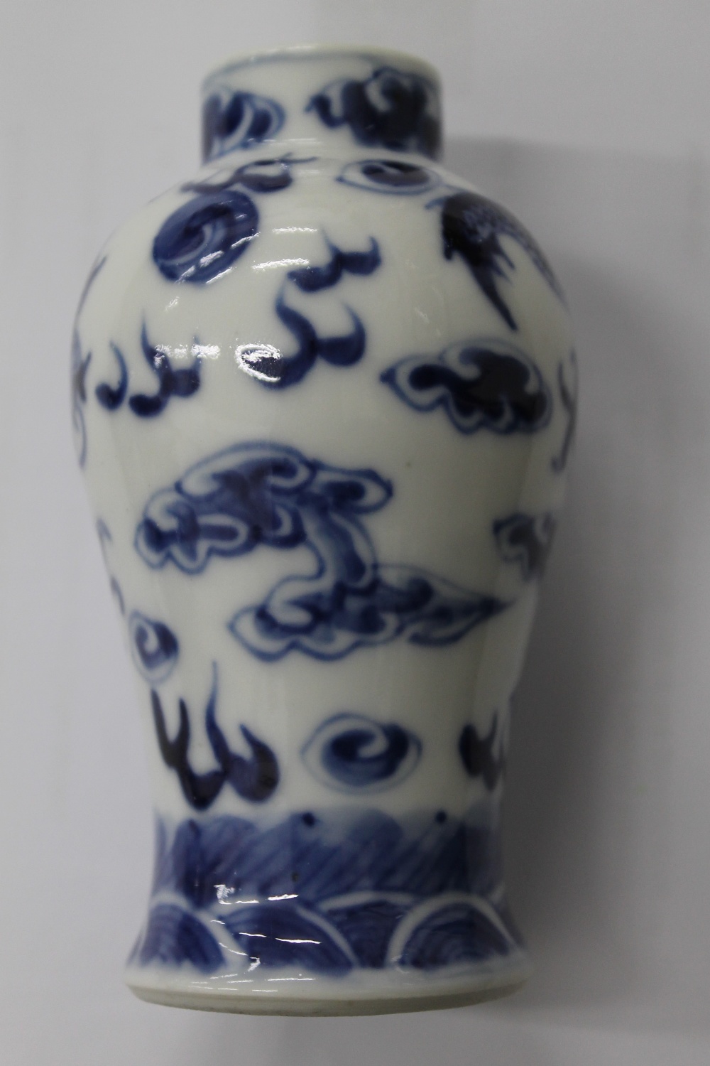 A pair of 19th century Chinese blue and white porcelain vases and covers, decorated with dragons. - Image 5 of 16
