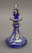 A Victorian gilt decorated blue glass scent bottle. 12.5 cm high.