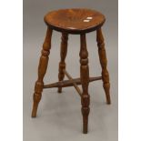 An elm stool. 52 cm high.