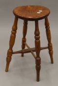 An elm stool. 52 cm high.