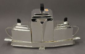 An Art Deco style silver plated tea set. 37 cm wide.