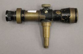 A black lacquered brass scope, possibly WWII period. 17 cm long.