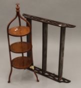 A Victorian satinwood cake stand and a mahogany wall shelf. The latter 71.5 cm wide.