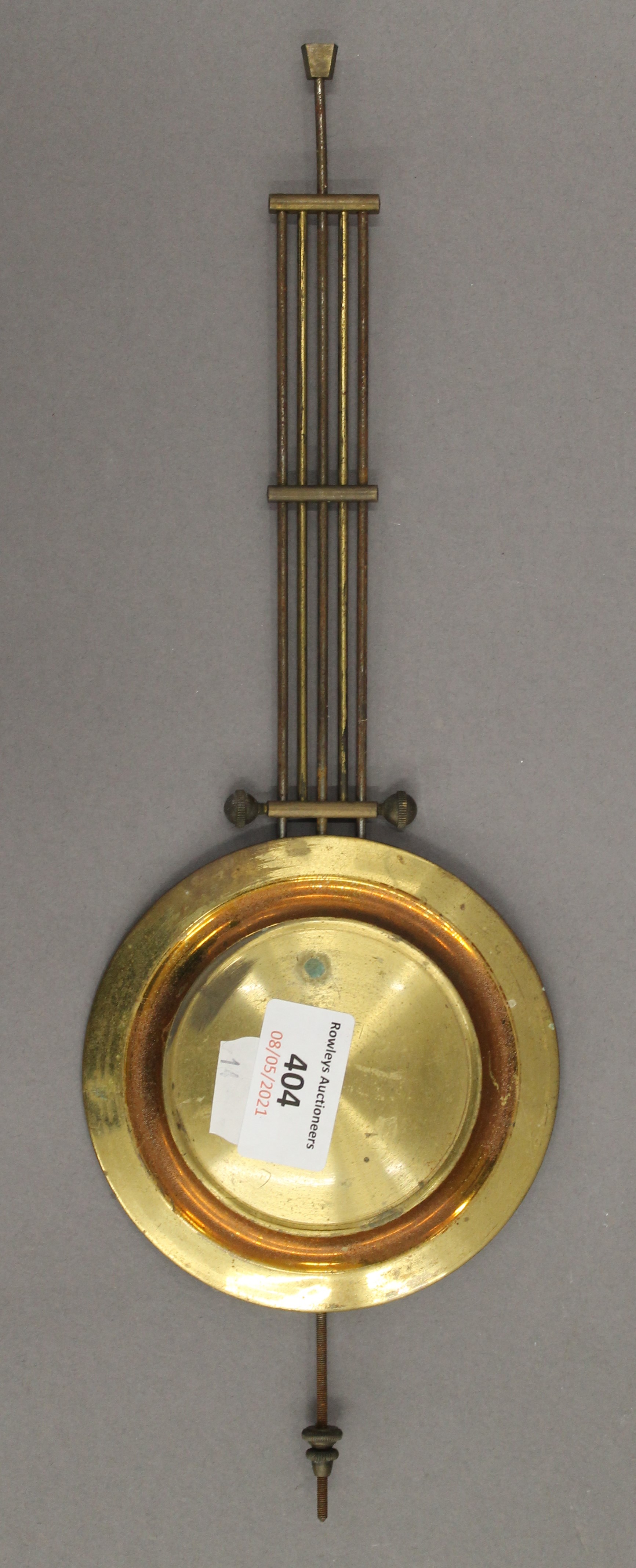 A clock movement and pendulum. 14.5 cm diameter. - Image 5 of 5