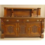 A Victorian carved walnut sideboard. 200 cm wide.