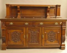 A Victorian carved walnut sideboard. 200 cm wide.