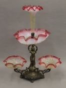 A cranberry glass mounted figural centre piece. 51 cm high.