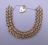 A 9 ct gold woven link bracelet. 21.8 grammes. Approximately 16 cm long.