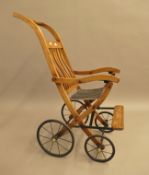 A Victorian child's invalids chair/pushchair. 45 cm wide.