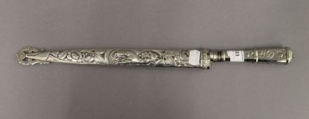 A 19th century Gaucho knife with solid silver scabbard (tested). 44 cm long. 5.2 troy ounces.