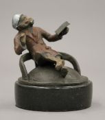 A cold painted bronze model of a monkey. 6.5 cm high.