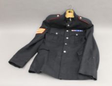 A quantity of military dress uniforms.