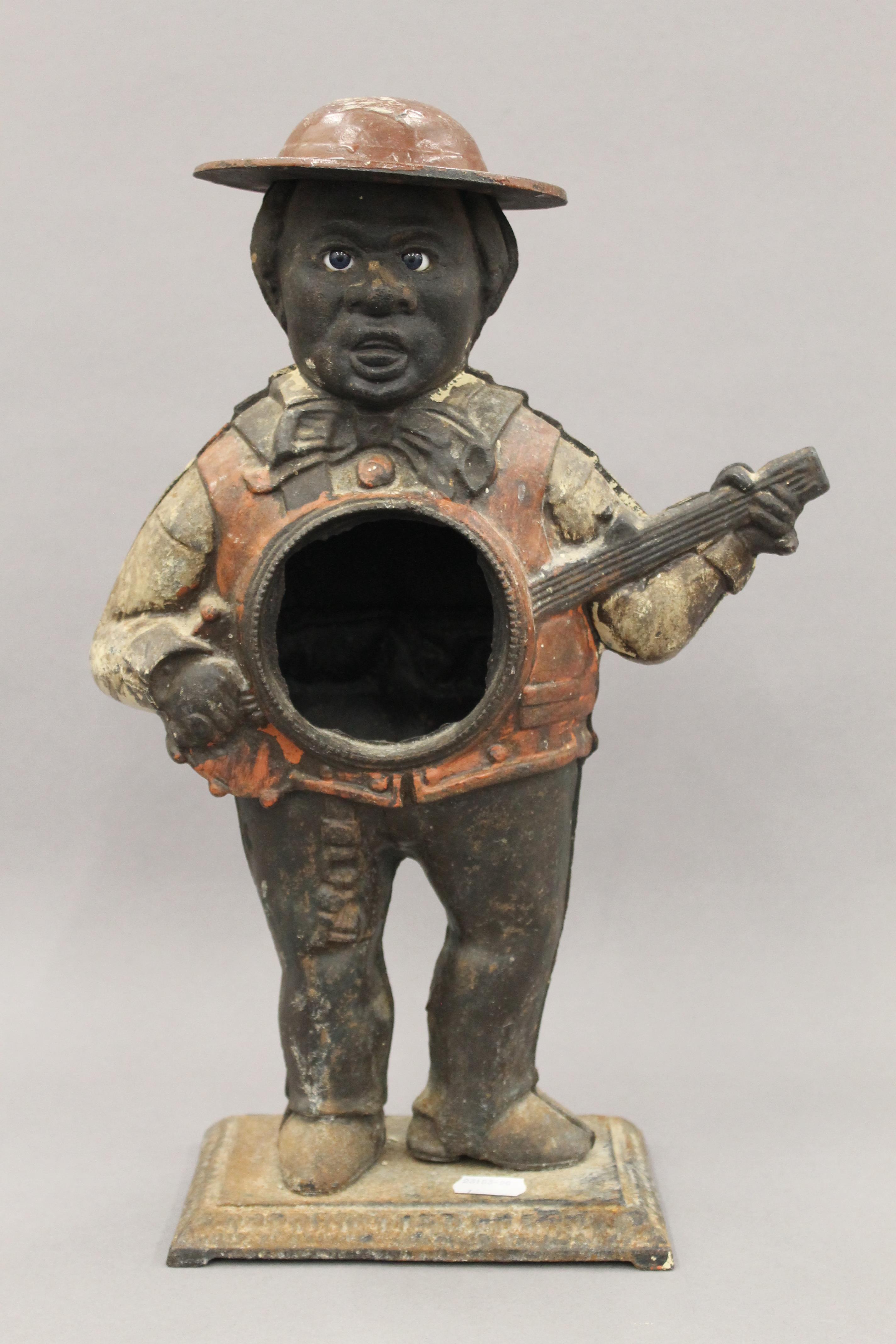 A cast iron figural clock case. 39 cm high.