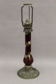 A Victorian metal mounted ruby glass table lamp. 58 cm high.