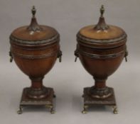 A pair of Adam revival mahogany lidded urns. 32.5 cm high, 15 cm wide.