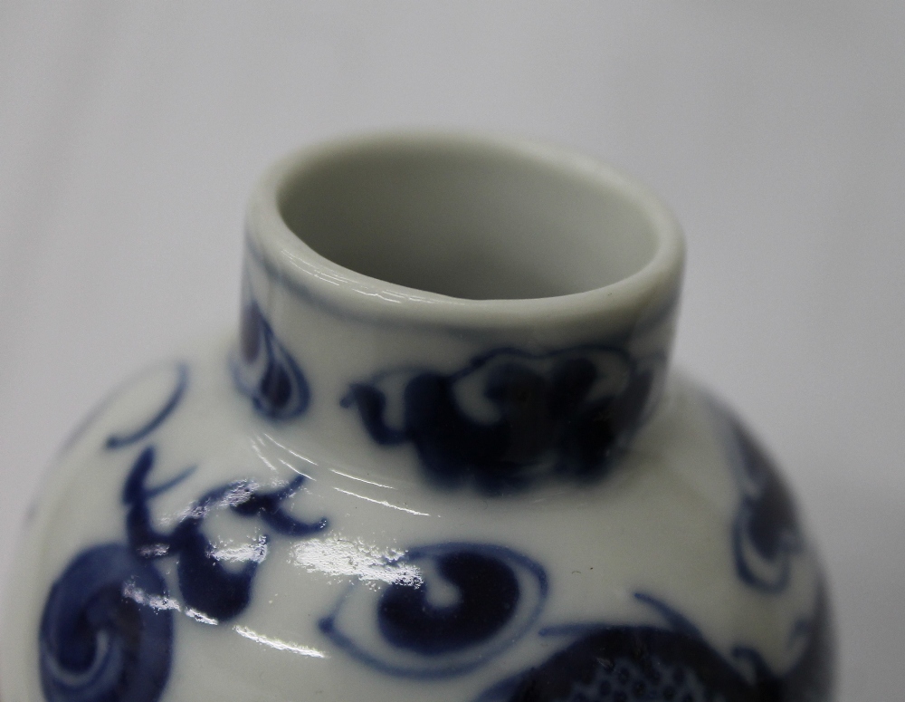 A pair of 19th century Chinese blue and white porcelain vases and covers, decorated with dragons. - Image 6 of 16