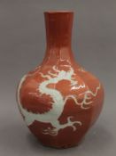 A Chinese hexagonal pottery vase decorated with dragons. 31 cm high.