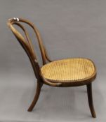 A vintage Bentwood cane seated chair. 46 cm wide.