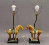 A pair of Chinese Tang style horse mounted lamps. 60 cm high overall.