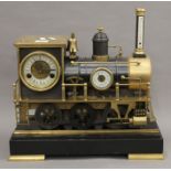 A large brass mounted train form clock. 40 cm long.