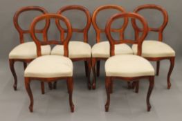 A set of six modern balloon back dining chairs