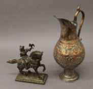 A copper ewer with Middle Eastern design and a figure on horseback. The former 32 cm high.