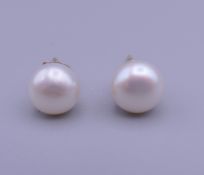 A pair of pearl earrings with 9 ct gold backs