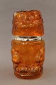 A silver plate and amber glass biscuit jar formed as a dog. 25 cm high.