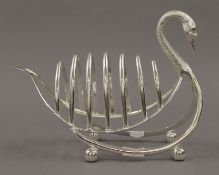 A silver plated toast rack formed as a swan. 21 cm long.