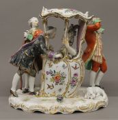 A 19th century Continental porcelain sedan chair group. 20.5 cm high.