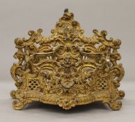 A gilt brass letter rack. 20 cm high.