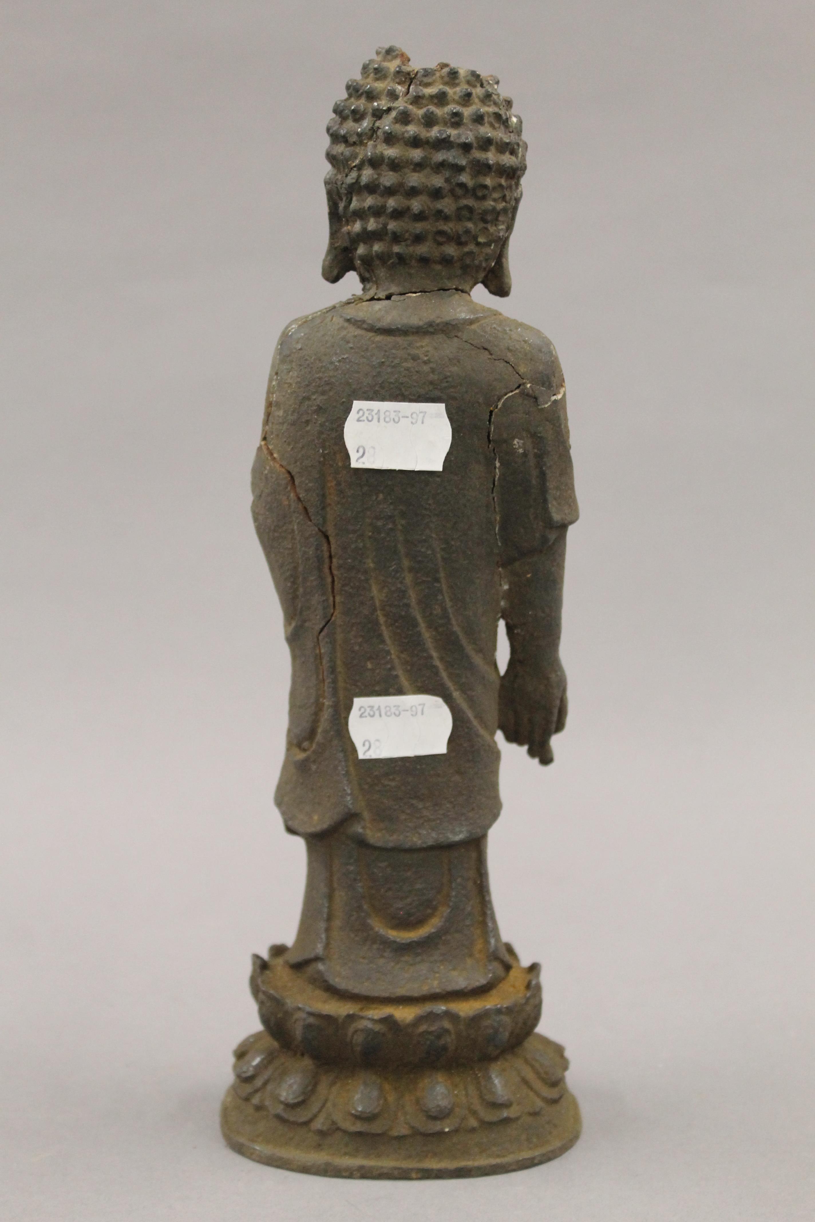 An antique Chinese iron model of buddha. 27 cm high. - Image 6 of 7