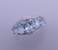 A silver aquamarine ring. Ring size P.