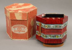 A vintage boxed concertina.