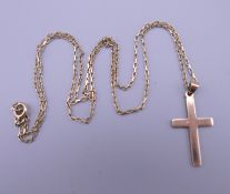A 9 ct gold cross on gold chain. 4.1 grammes.