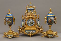 A 19th century gilt and painted porcelain three-piece clock garniture. The clock 37 cm high.