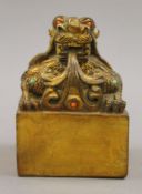 A gilt bronze fo dog seal. 12.5 cm high.