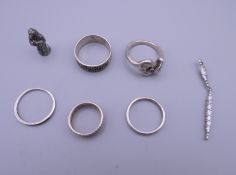 Seven pieces of silver jewellery.